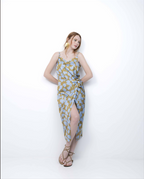 Woman wearing a patterned dress on a white background