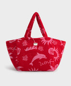 Red tote bag with pink dolphin designs and 'woof' text on a white background