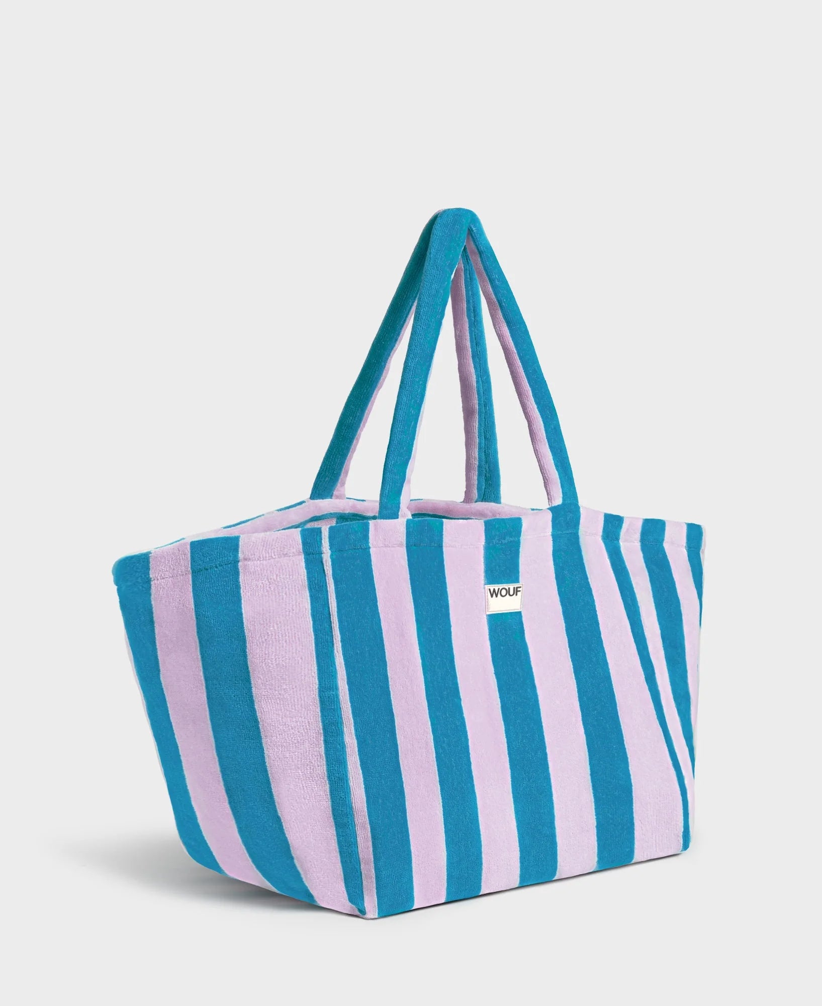 Striped tote bag with blue and pink stripes on a white background