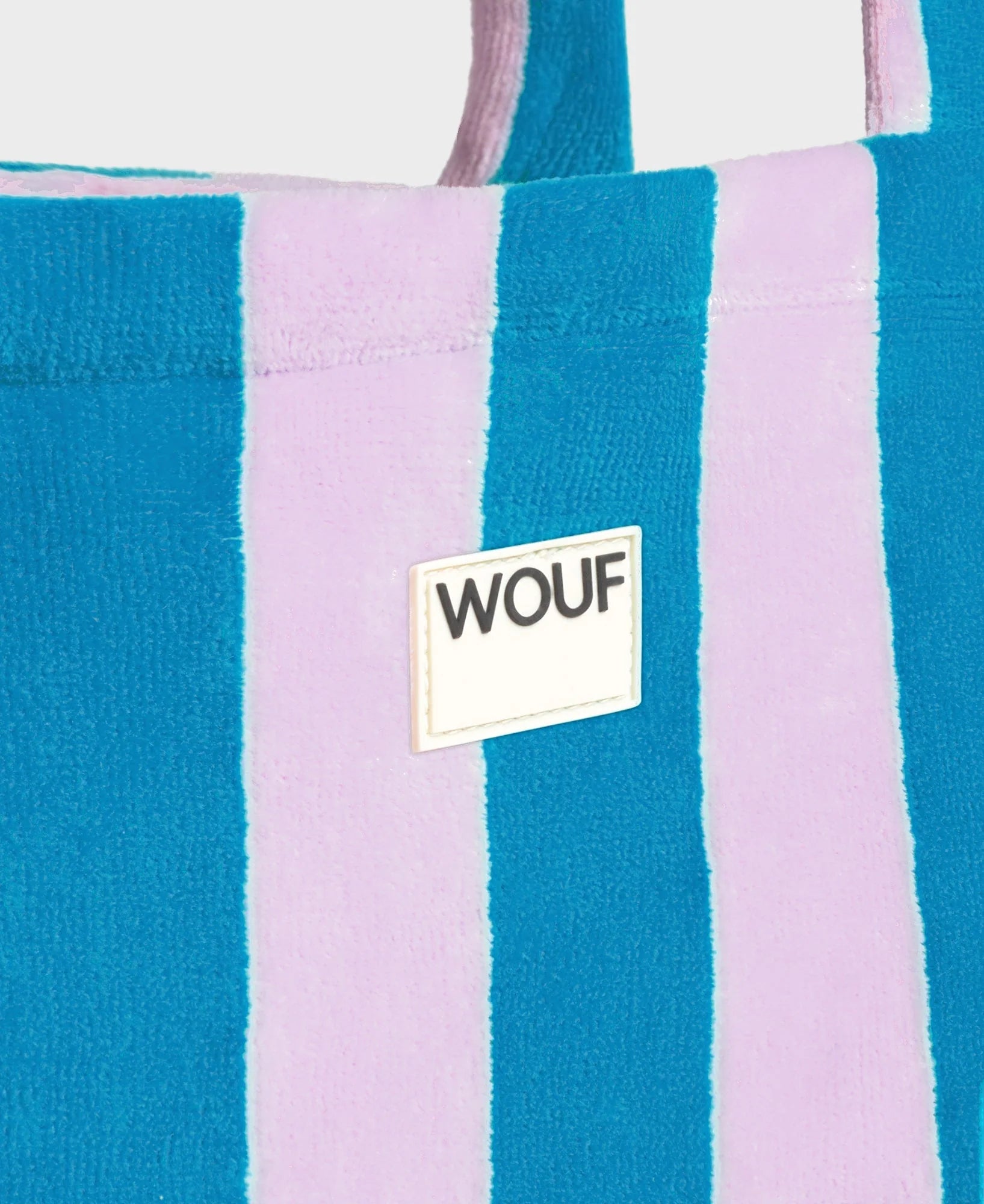 Striped tote bag with WOUF logo on a white background