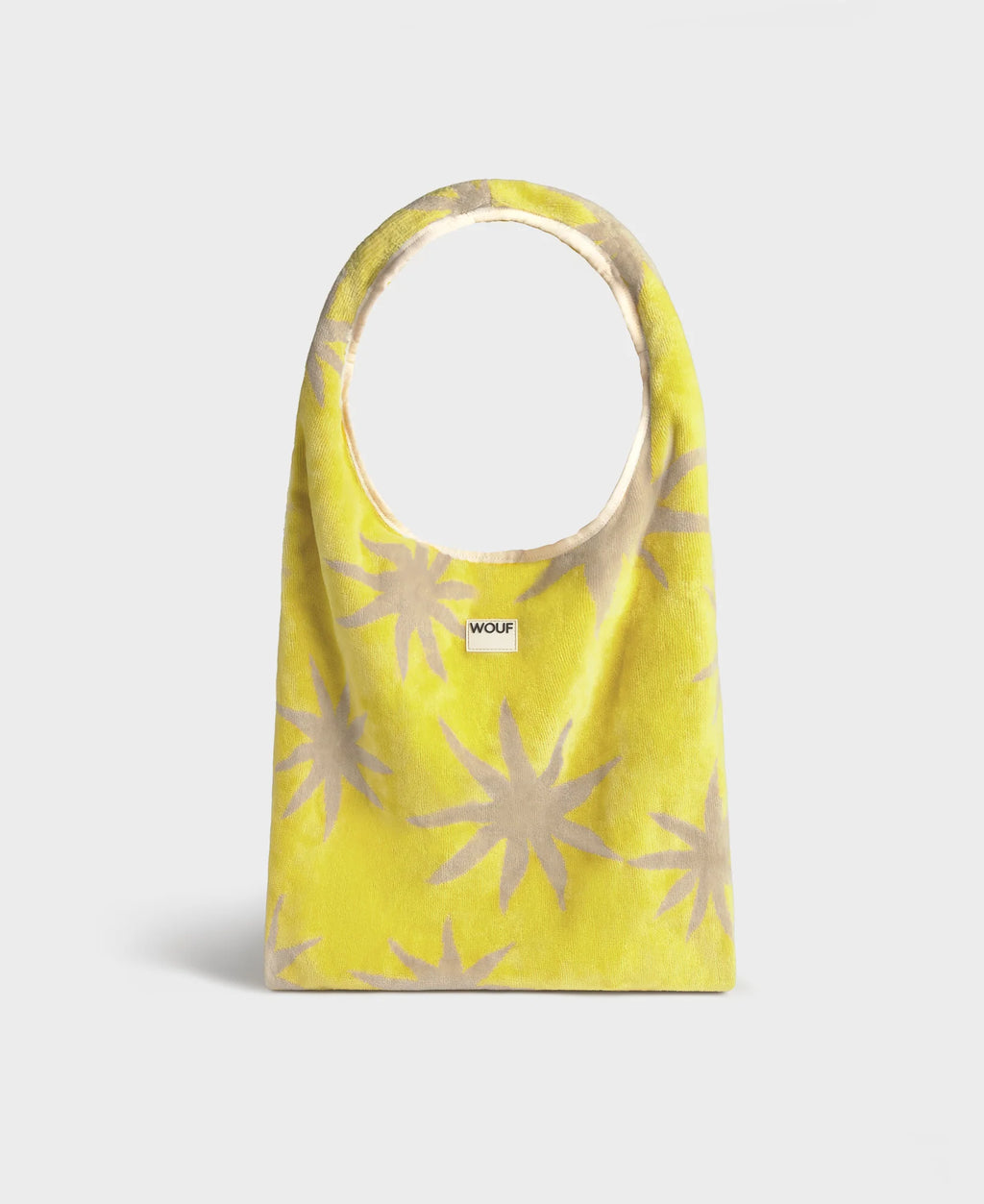 Yellow bag with beige star patterns on a white background