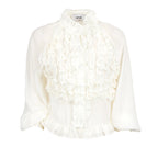 An off-white long-sleeve blouse featuring a high ruffled collar, a layered ruffle bib front, and a ruffled hemline, shown against a plain white background.