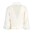 An off-white sheer long-sleeve blouse shown from the back, featuring a ruffled high neck, a large V-shaped back cutout, and a ruffled hemline.
