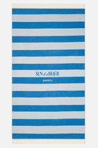 Striped beach towel with 'Sun of a Beach' logo on a white background