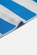 Close-up of a blue and gray striped fabric on a white background
