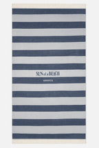 Striped beach towel with 'Sun of a Beach Greece' text on a white background