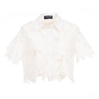White feathered garment on a white background with a visible brand label.