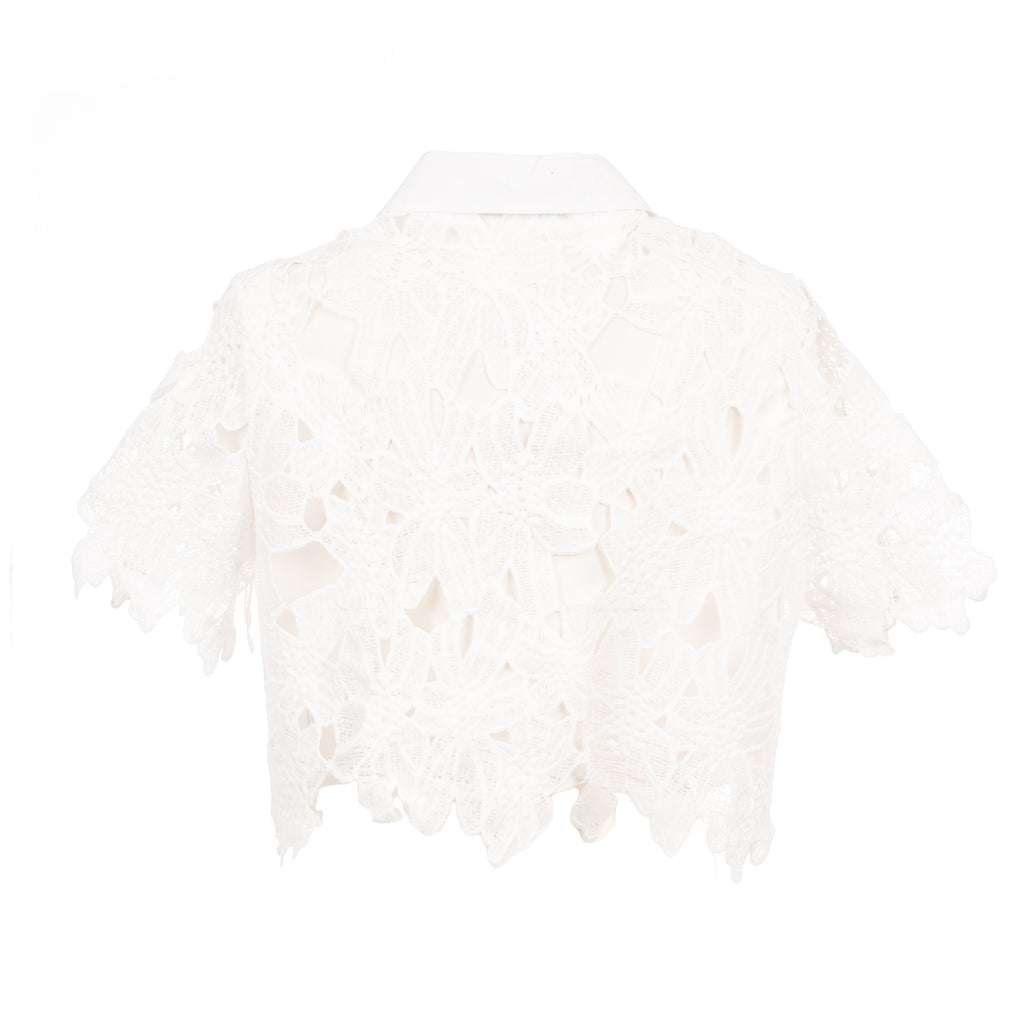 White lace shrug on a white background