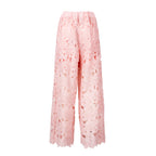 Pink lace pants on a white background