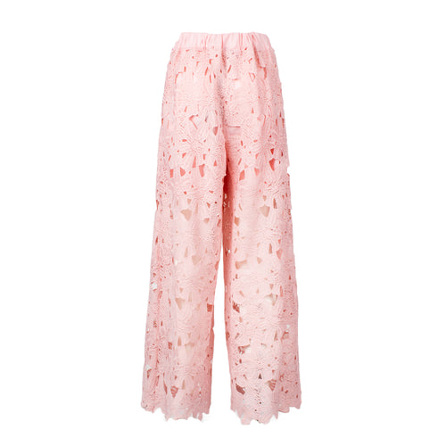 Pink lace pants on a white background
