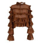 A brown sheer mesh long-sleeve blouse with multiple tiers of ruffles, a high ruffled collar, and tiered ruffle cuffs, shown against a plain white background.