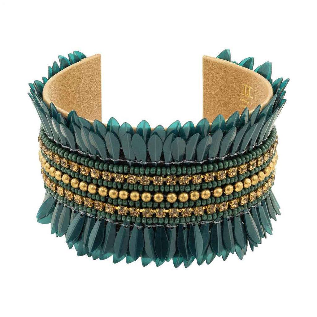 Green spiked bracelet with gold beads on a white background