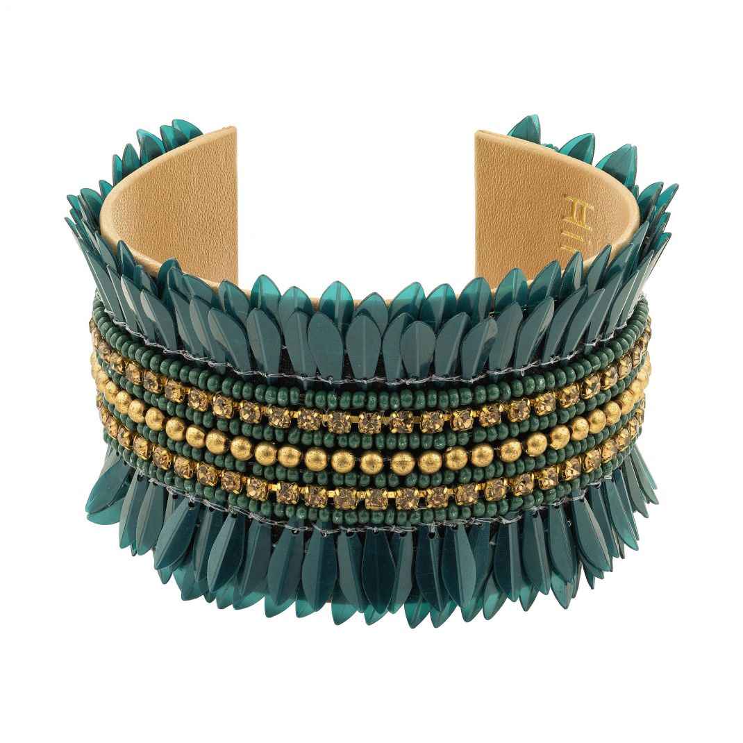 Green spiked bracelet with gold beads on a white background