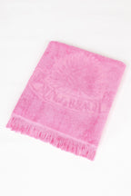 Pink towel with text on a white background