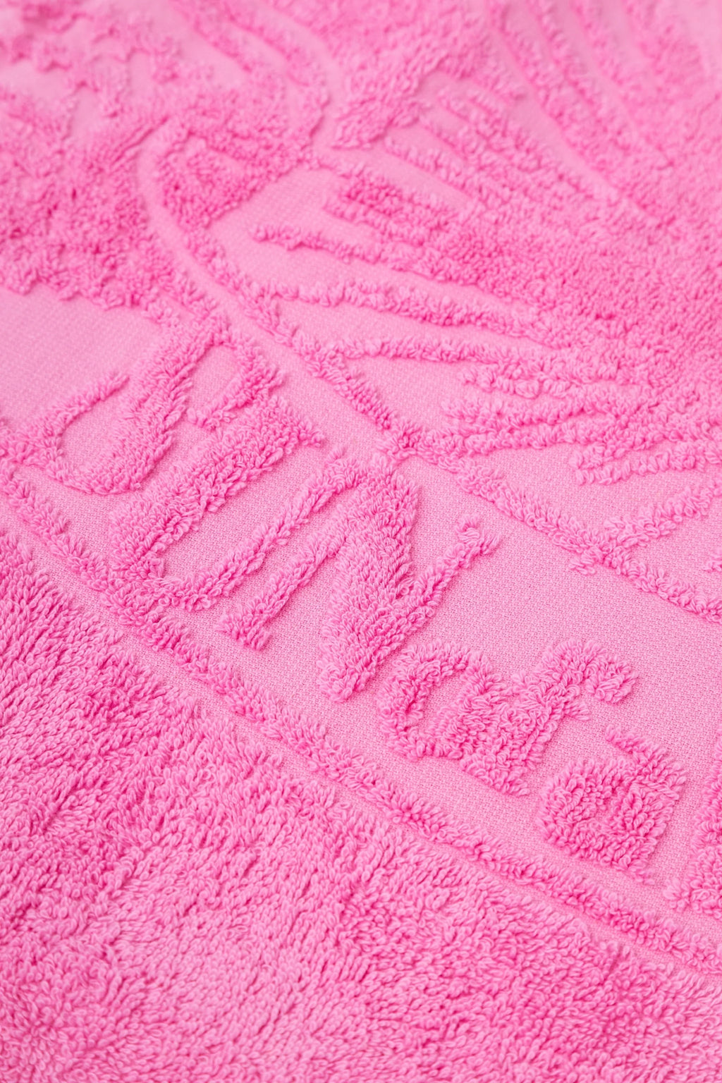 Close-up of a textured pink towel with a pattern
