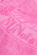 Close-up of a textured pink towel with a pattern