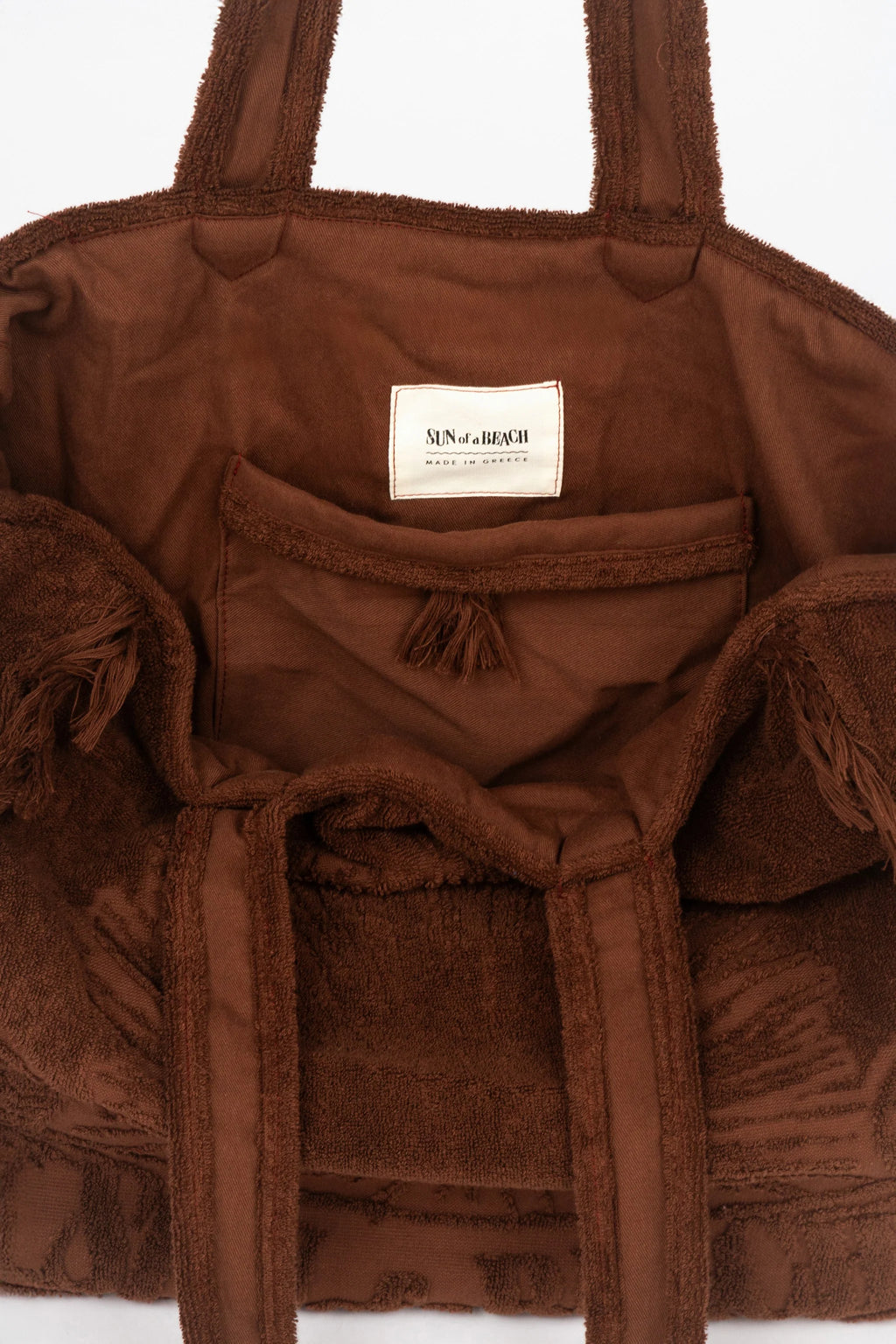 Brown textured bag with a visible brand label on a white background