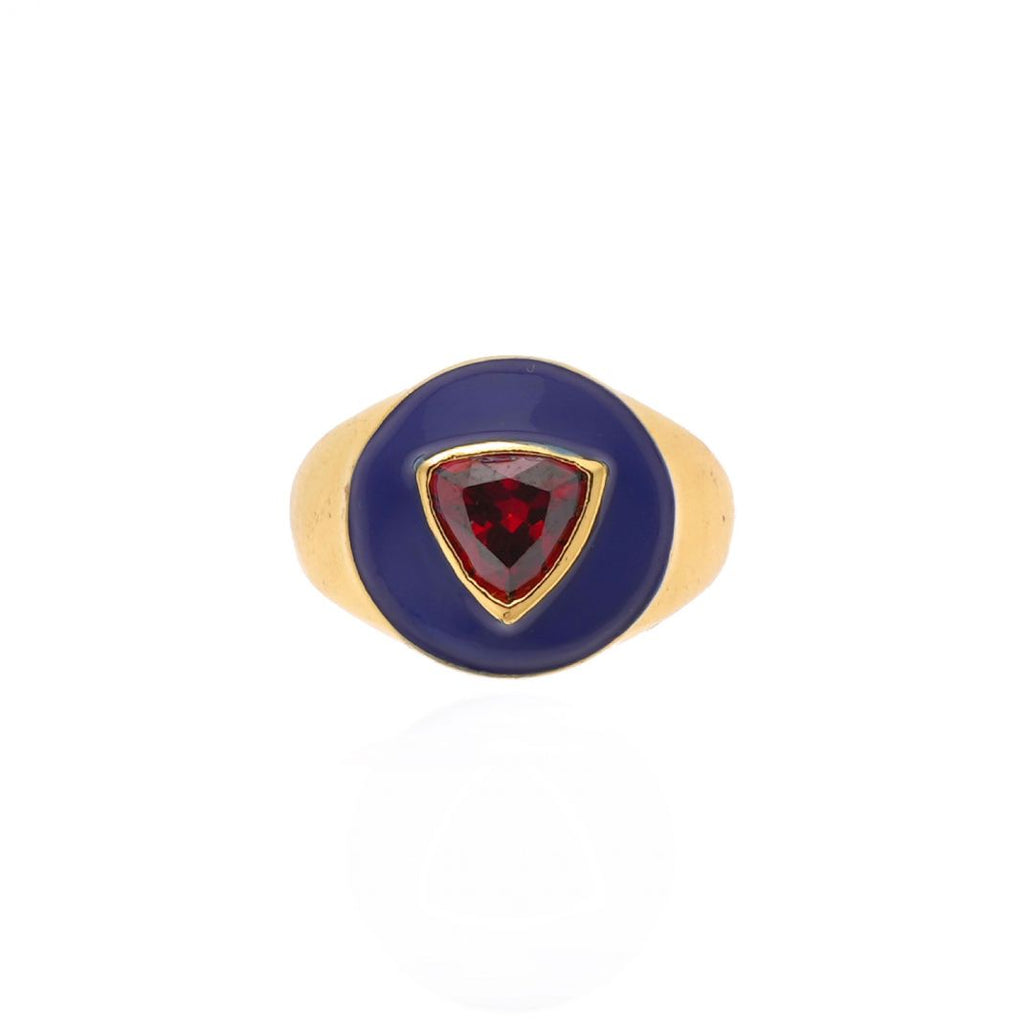 Gold ring with a red gemstone on a white background