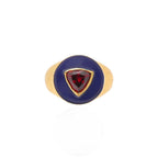 Gold ring with a red gemstone on a white background