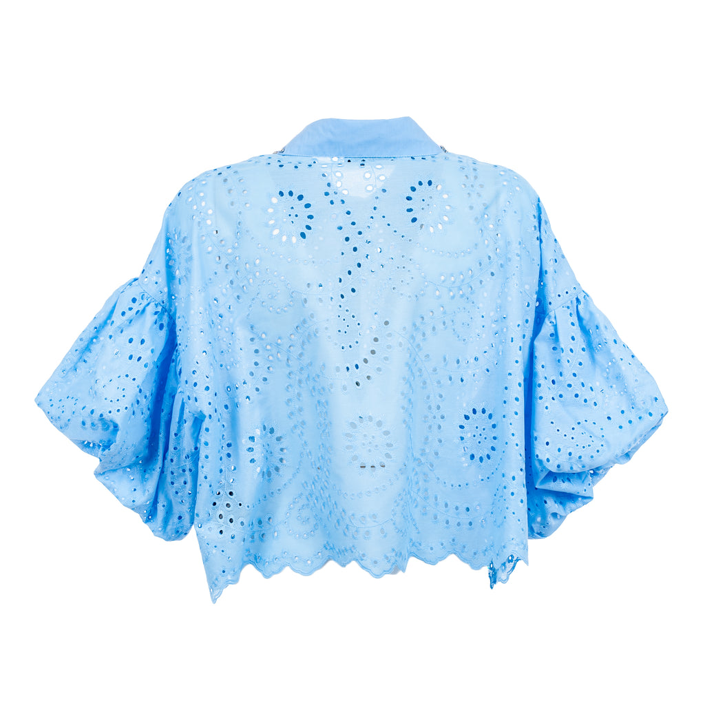 Light blue openwork top on a white background