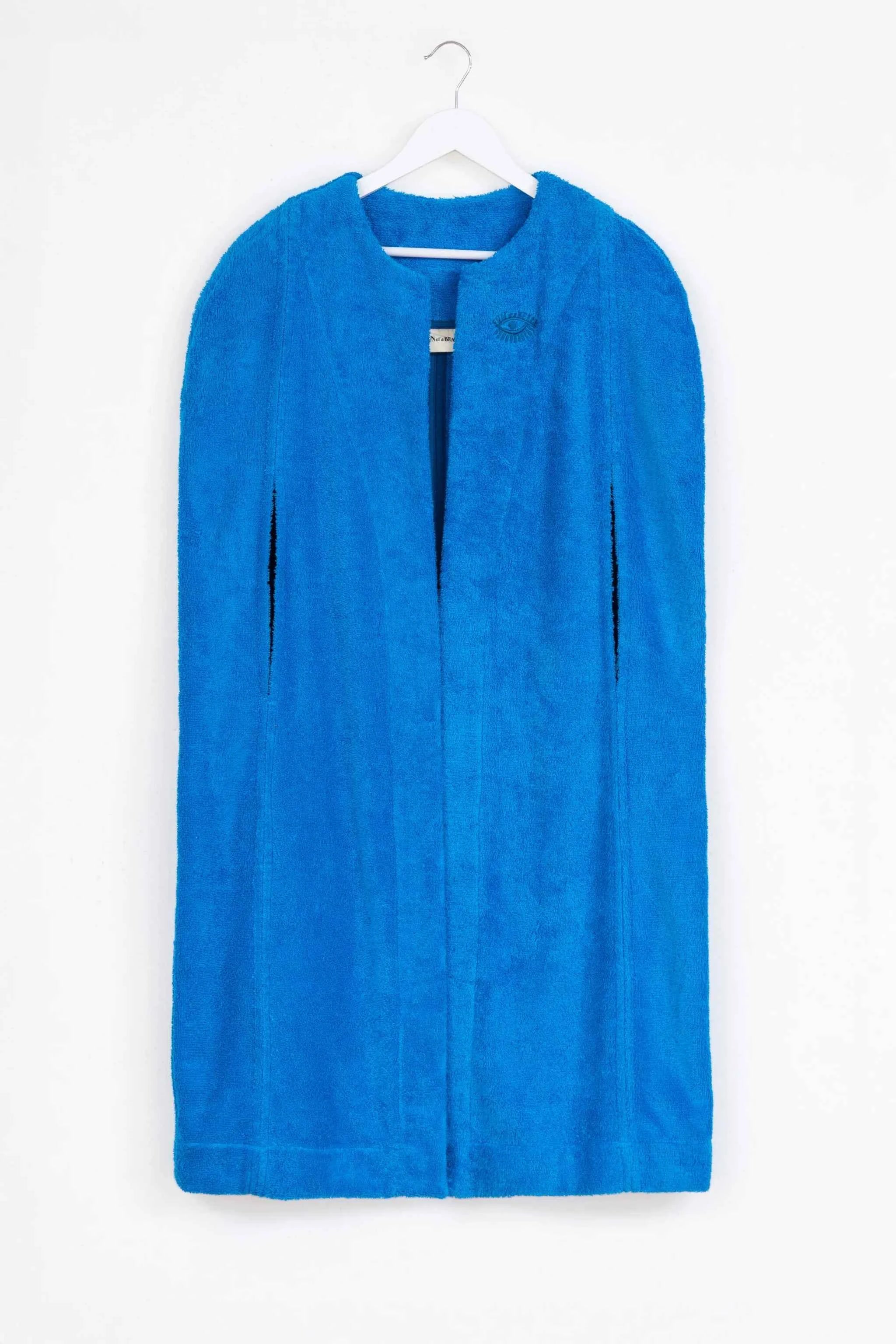Blue garment cover on a white hanger against a white background