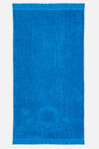 Blue towel with a brand logo on a white background