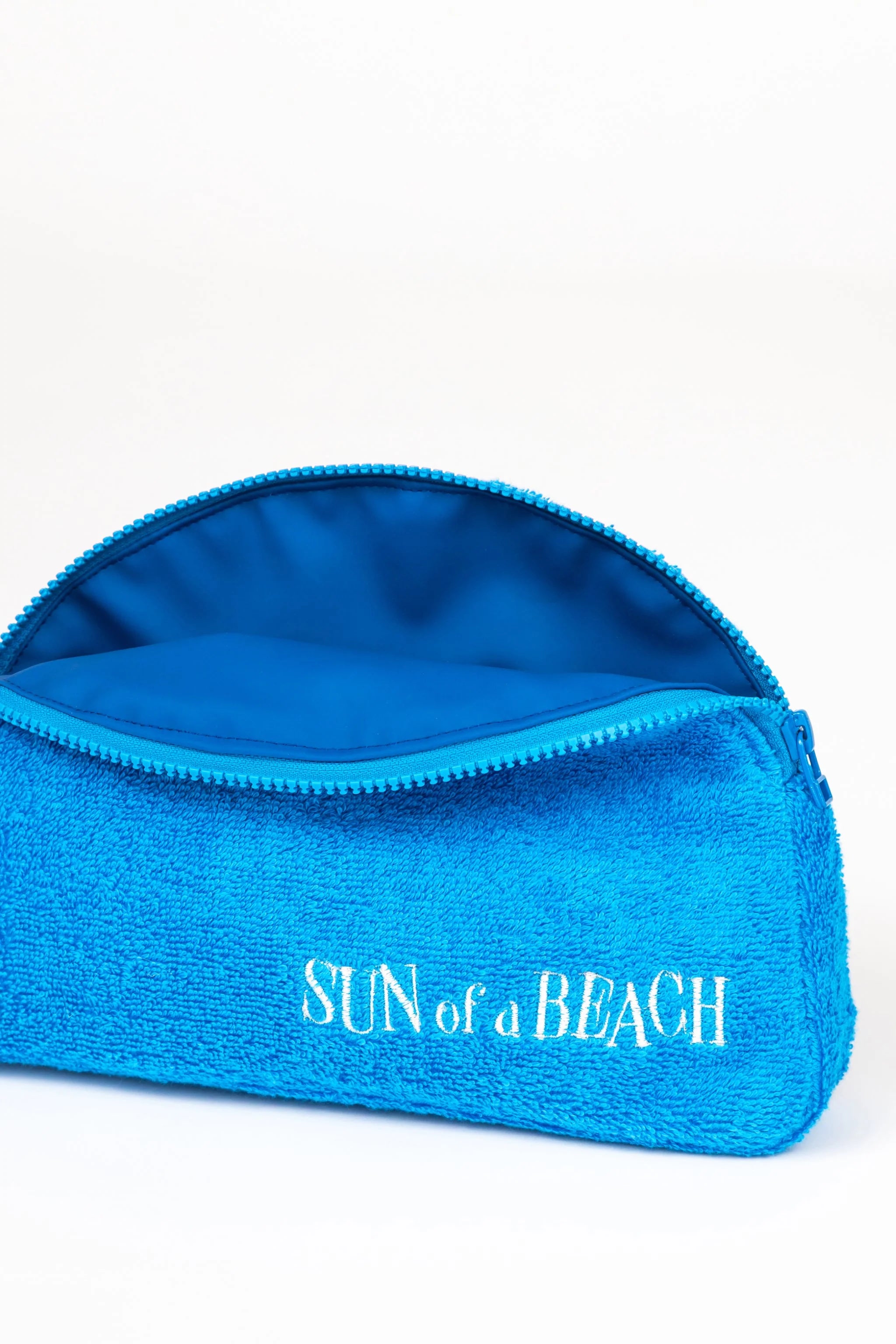 Blue pouch with 'Sun of a Beach' text on a white background