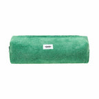 Green foam roller with a brand label on a white background