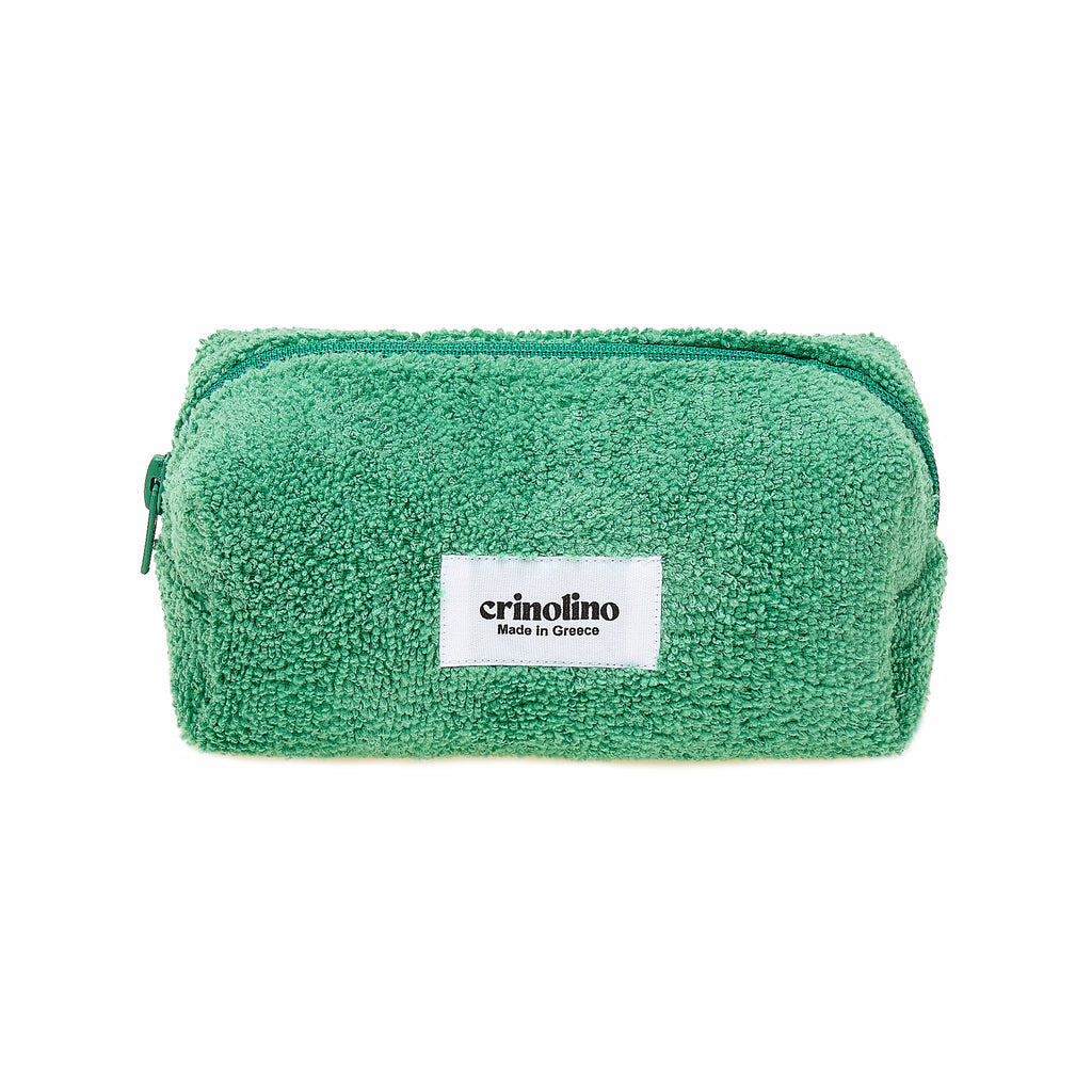 Green towel with a white label on a white background