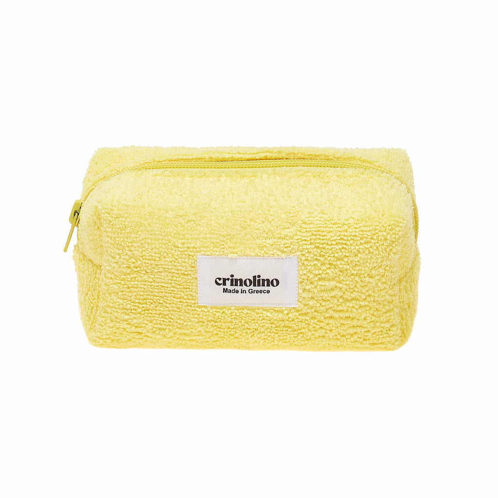 Yellow textured pouch with a visible brand label on a white background