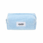 Light blue textured pouch with a visible brand label on a white background
