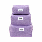 Three purple towels stacked on a white background with 'crinolino' branding.