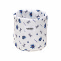 White container with blue floral and bow pattern, featuring a 'crinolino' label.