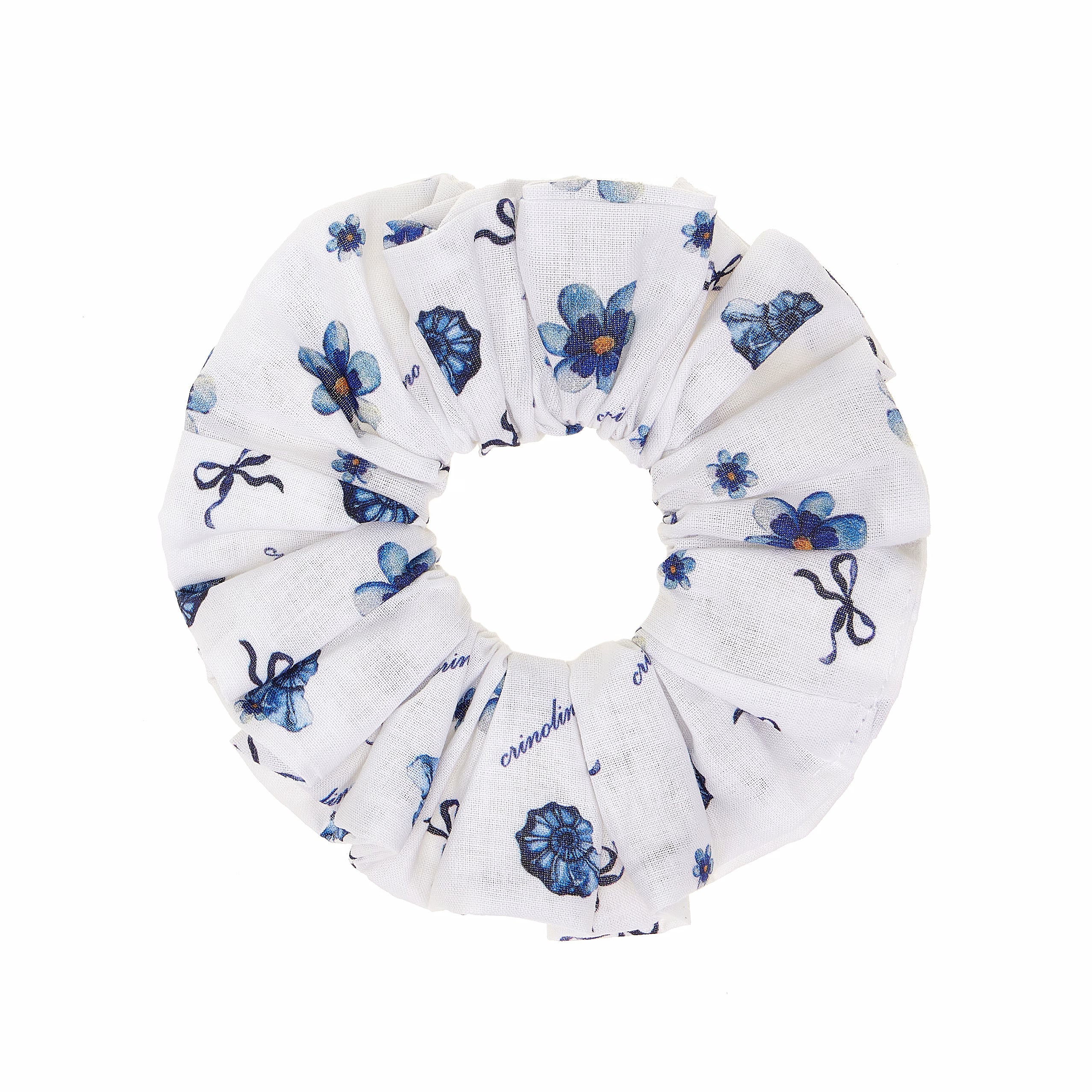 White scrunchie with blue floral and bow pattern on a white background