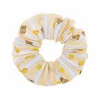 Scrunchie with lemon and bottle pattern on a white background