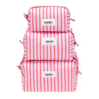 Set of three pink and white striped bags with 'crinolino' labels on a white background