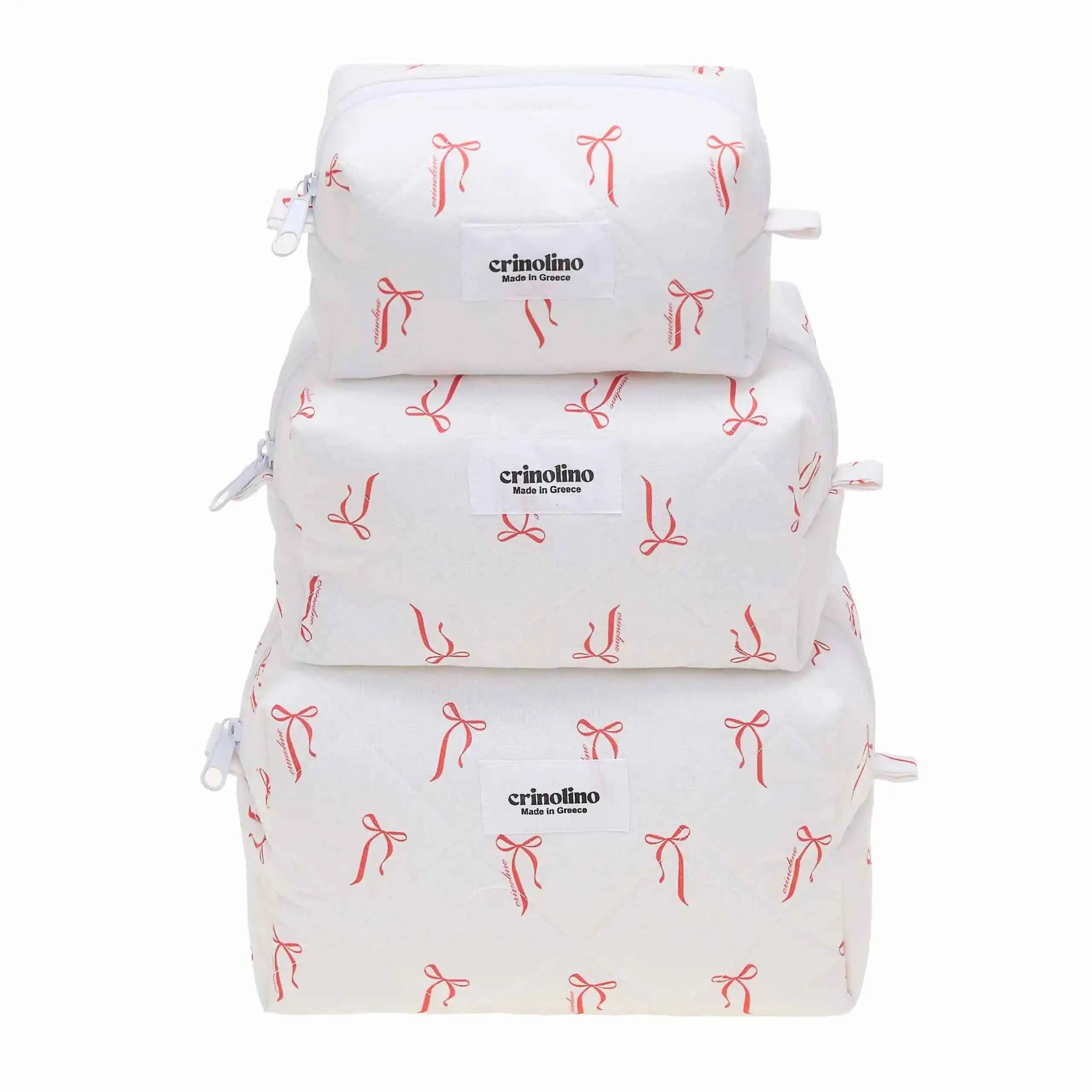 Three white bags with red bow patterns stacked on a white background, featuring the 'crinolino' brand.