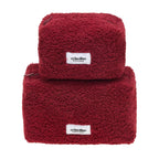 Two red textured bags with 'crinolino' labels on a white background