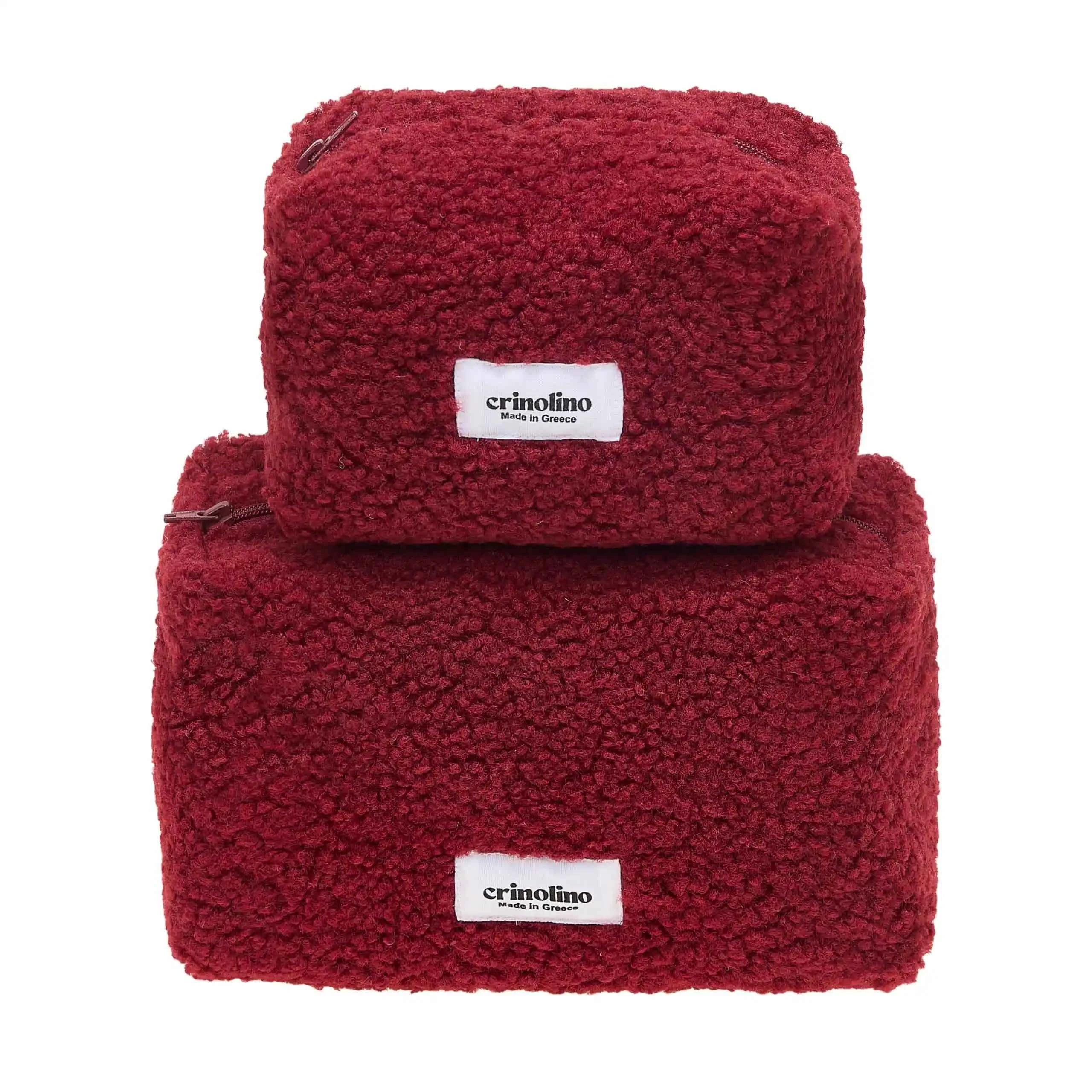 Two red textured bags with 'crinolino' labels on a white background