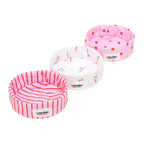 Three pet beds with different patterns and designs on a white background