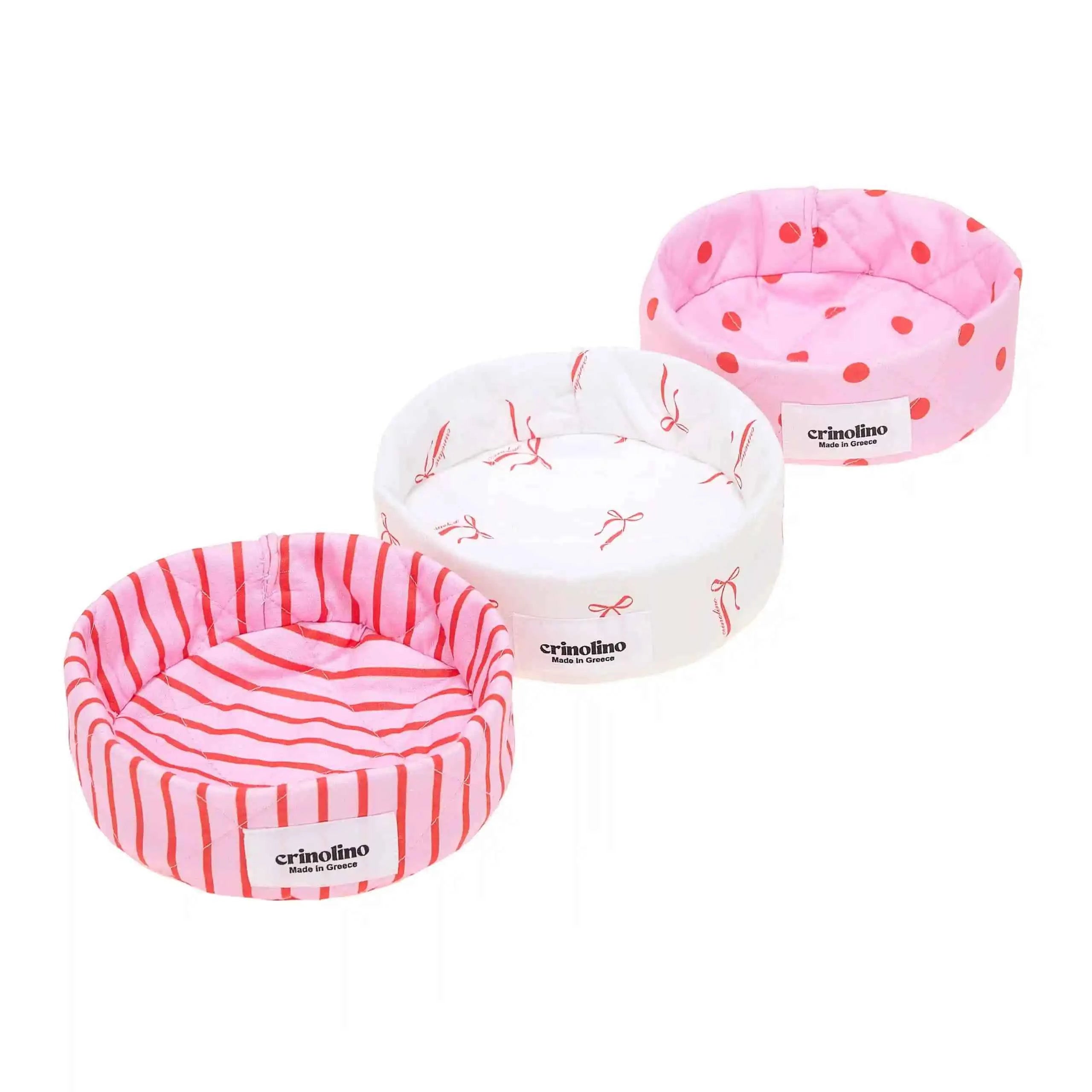 Three pet beds with different patterns and designs on a white background