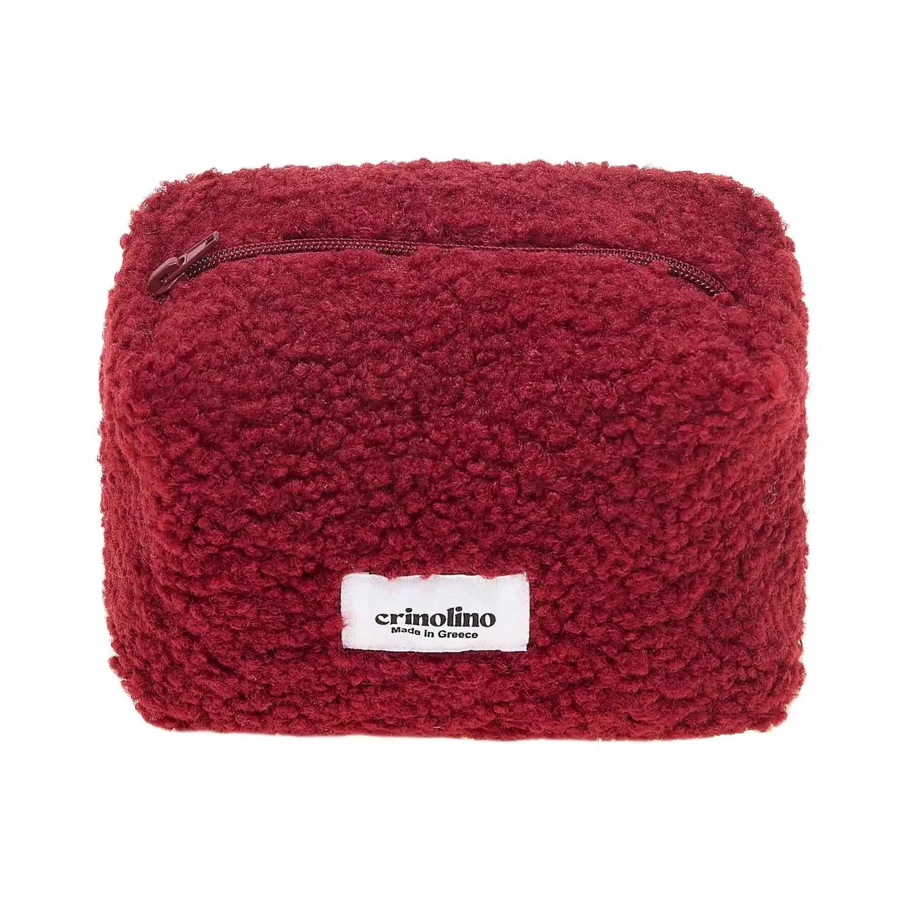 Red textured pouch with a visible brand label on a white background