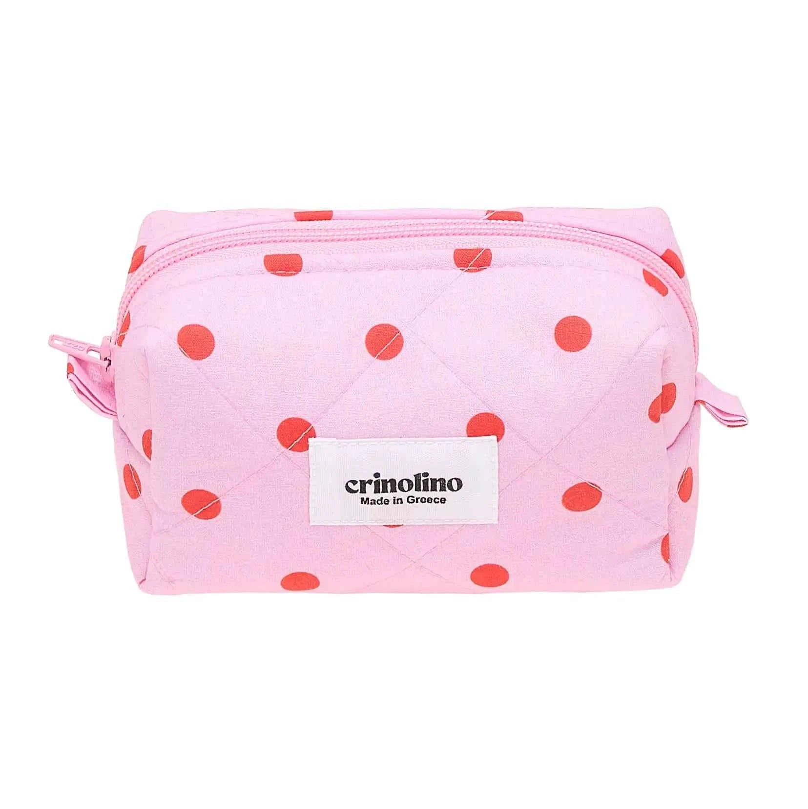 Pink pouch with red polka dots and 'crinolino' brand label on a white background