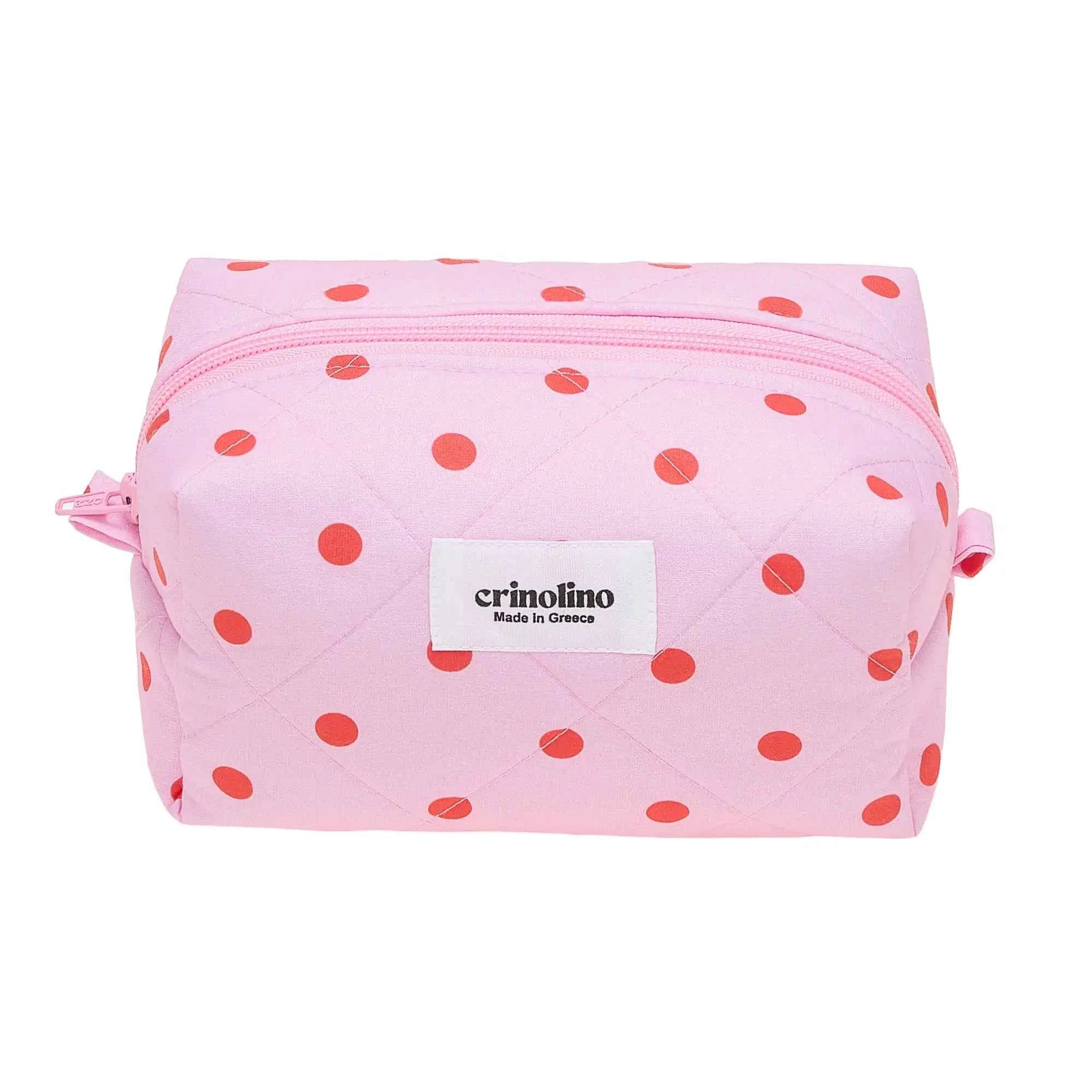 Pink polka dot pouch with a visible brand label on a white background