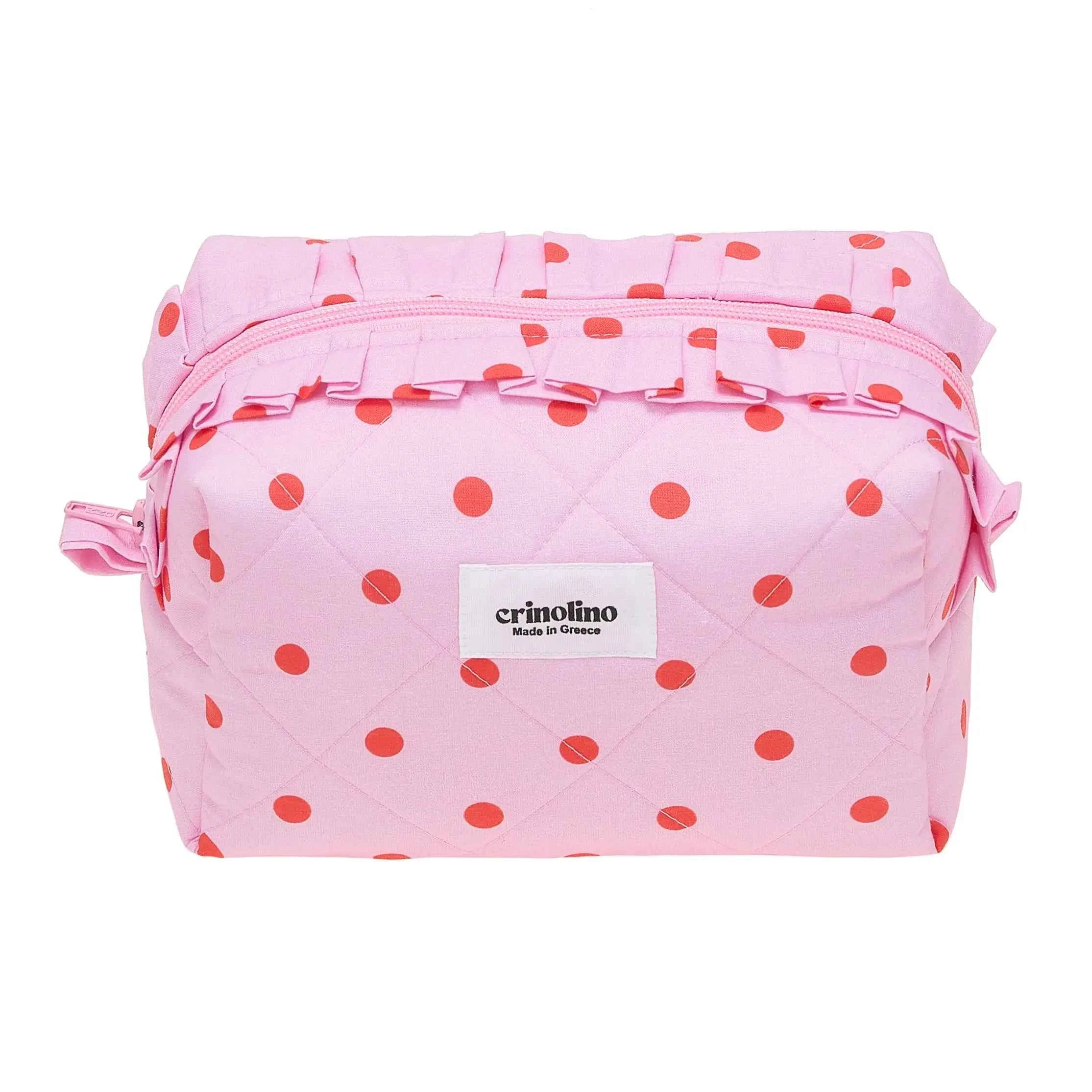 Pink polka dot bag with a visible brand label on a white background