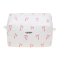 White pouch with red bow pattern and 'crinolino' branding on a white background