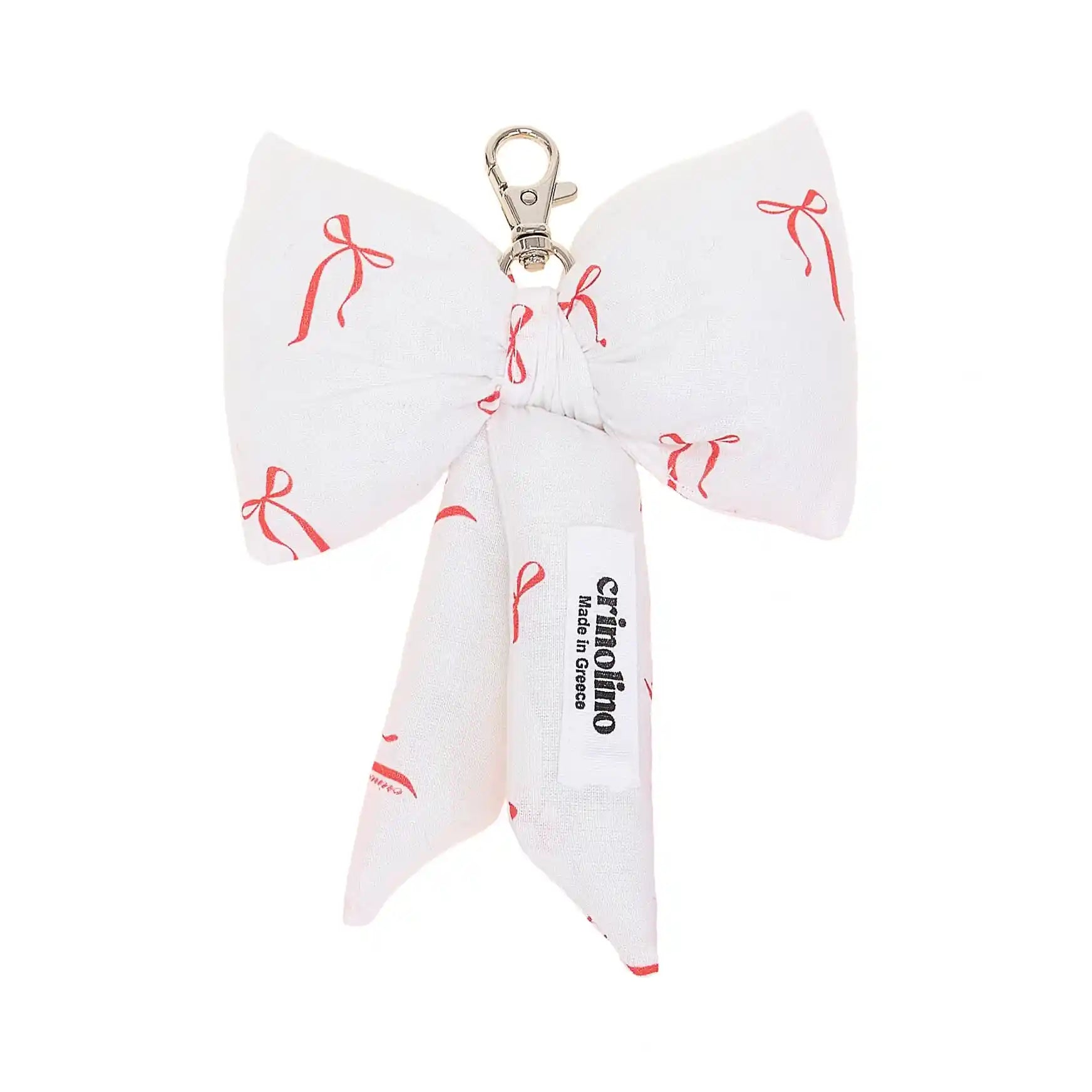 White bow-shaped keychain with red bows pattern and 'crinolino' branding on a white background