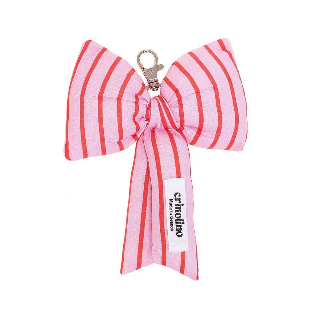 Pink and red striped bow keychain with a visible brand label on a white background