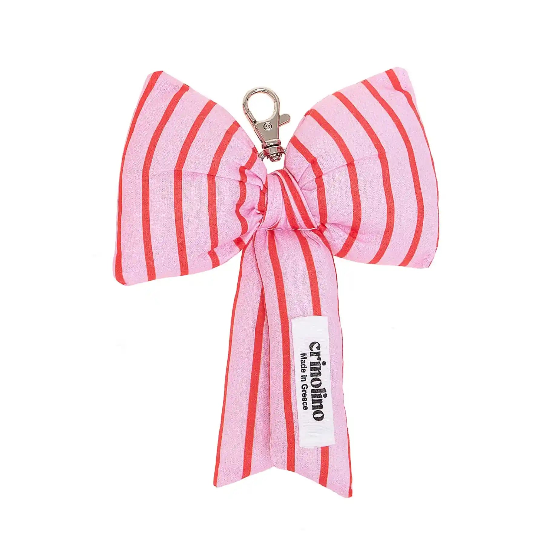 Pink and red striped bow keychain with a visible brand label on a white background