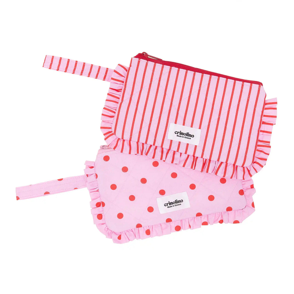 Pink and red striped long-sleeve top and pink polka dot shorts with 'crinoline' label on a white background